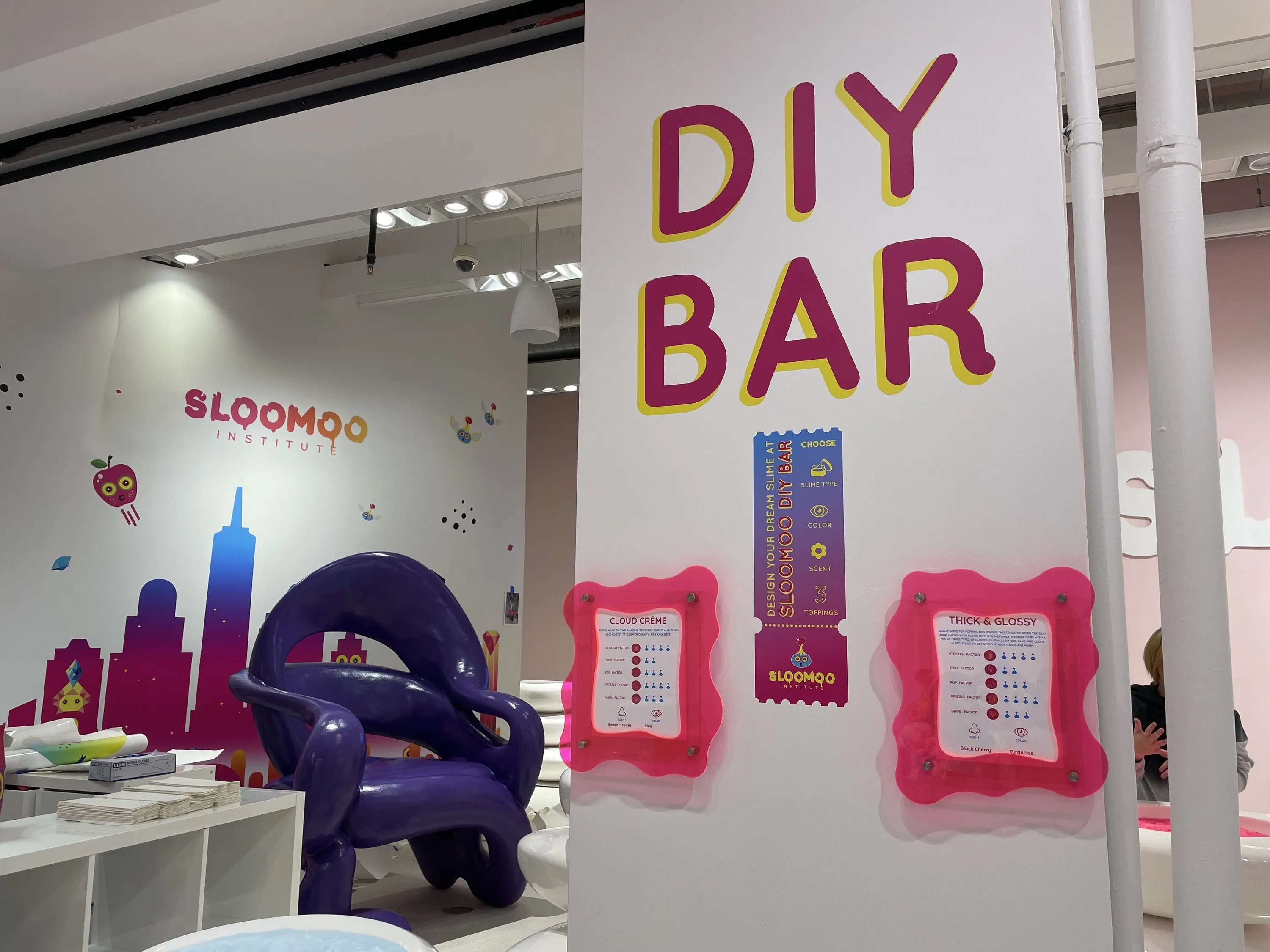 A sign reading DIY Bar leading to the venue's slime creation space.